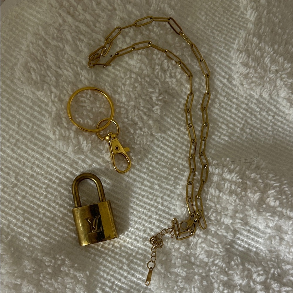 Auth. Louis Vuitton Lock #301 & gold tone chain